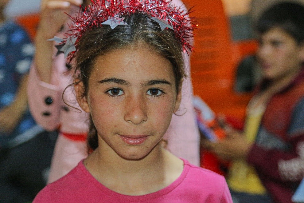 “I just don’t want anything more than being like other children” Qamar   is a ten-year-old Syrian girl but what did she go through to say such thing?  The little girl opened her eyes to a country ravaged by war for the past 12 years and so did seven million other children. This left them in a dire need of humanitarian assistance.   Unfortunately, survival mode is all Qamar knows. So, when her mother began talking about life pre-war, her brain couldn’t fathom a day without feeling afraid. She just sat back and listened.  “We used to live a decent life and my husband provided everything we needed”.   When the war broke out, the family was living in Northern Syria, they never thought the situation would escalate as it did in 2016. A state of forced evacuation was declared. The sky rained rocket instead of merciful rain and sirens blared echoing sounds informing it was time to leave. This meant the family had nothing to stay for. So, they followed suit and the city became a ghost town.   Luckily the family was able to arrive safely in the Northwest and could secure a small room to stay in. However, things were far from perfect, “we lost everything, we lived in a displacement camp, we couldn’t [still can’t] afford food. Sometimes my children sleep feeling hungry,” the mother shares.  Qamar was only five years old at that time and no child should have to go through a traumatising experience. But her father wanted to get his family to safety.  That’s when things began going downhill. The father couldn’t secure a job due to health problems. The mother wasn’t able to support either because the dreadful living conditions in the camp affected her physical and mental health, she was barely able to run errands. Meanwhile, Qamar was witnessing this drastic change without being able to process anything.  This affected her on multiple levels, her body weakened due to lack of food and she later developed a growth deficiency disorder. She shares, “we are in need of many things my parents can’t provide. I just want to grow up healt
