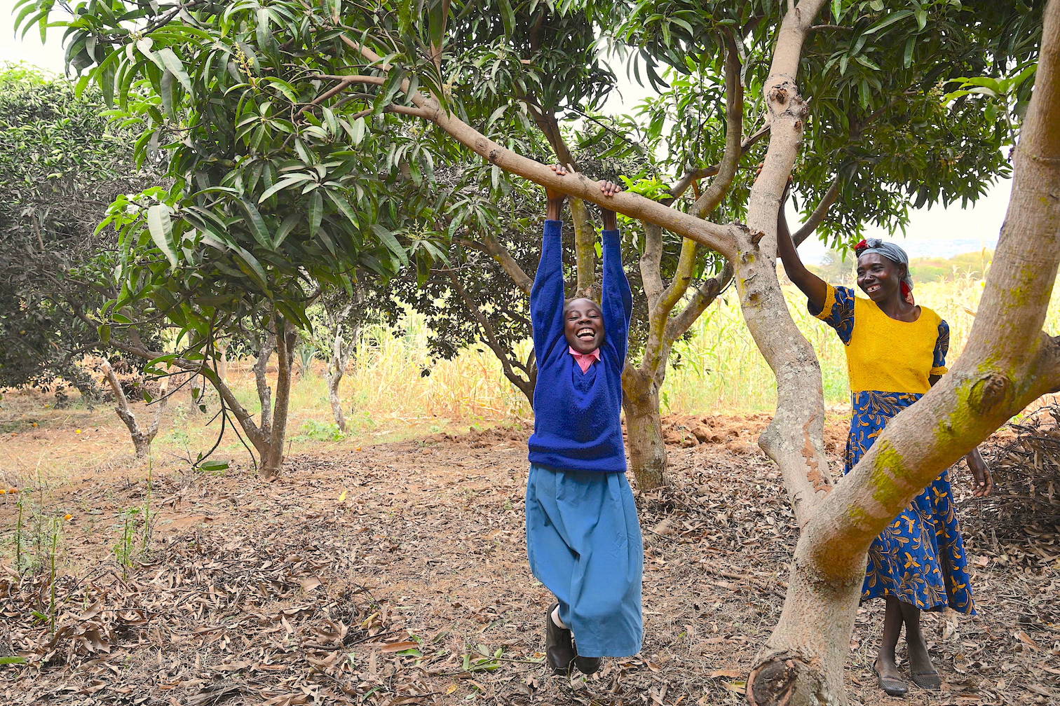 Thirteen-year-old Mercy enjoys playing under the shade of the numerous trees in their farm. ©World Vision Photo/Sarah Ooko.