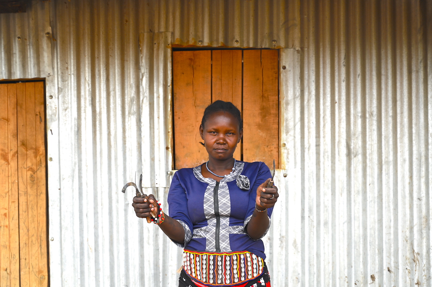 Chepundo displays the various sharp tools used to perform FGM in her community. The practice endangers the lives of girls and women. ©World Vision Photo/Sarah Ooko.