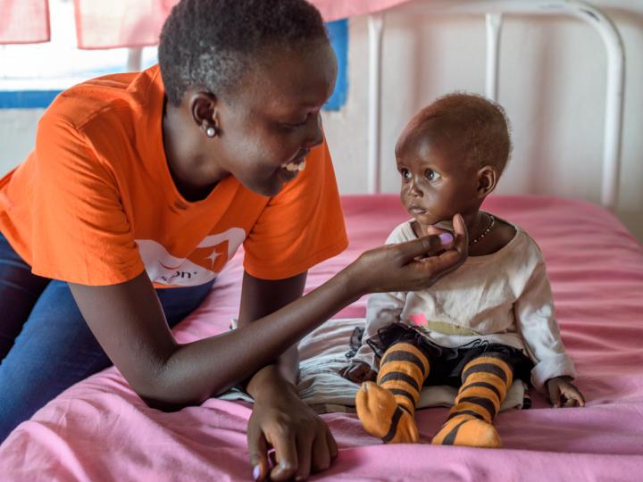 World Vision feeding malnourished child