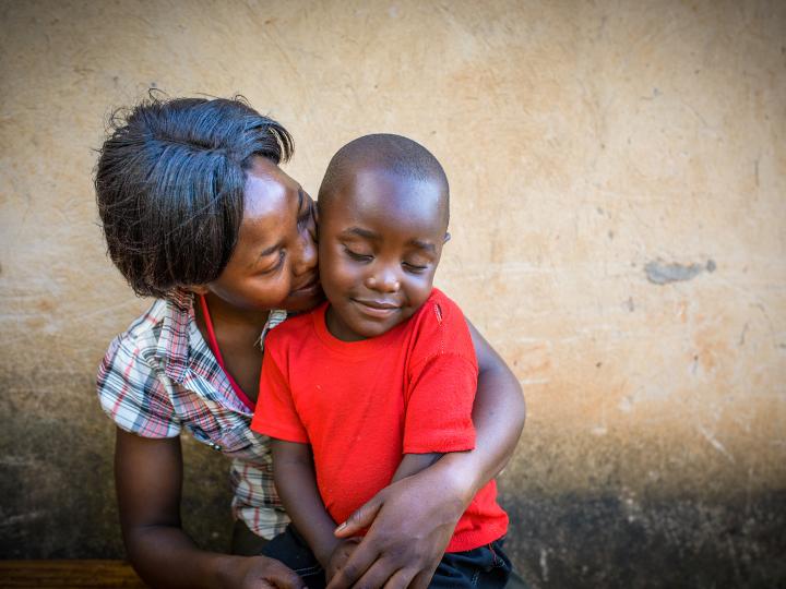 A mother holds her child