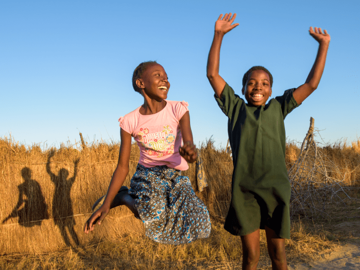 Two girls jumping