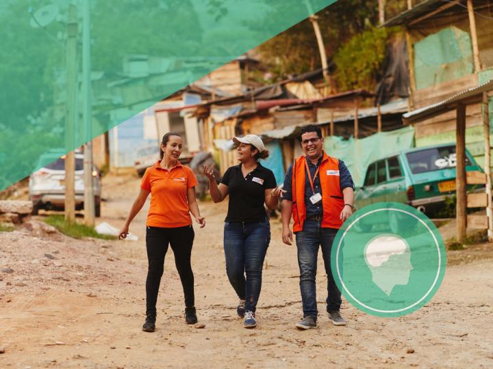 Mindsets and behaviours, world vision staff walking on road in Colombia