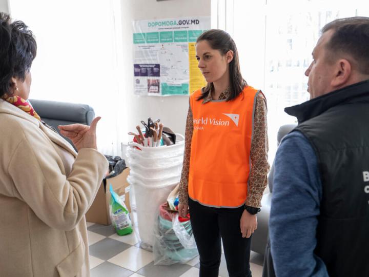 World Vision staff speaks to partners