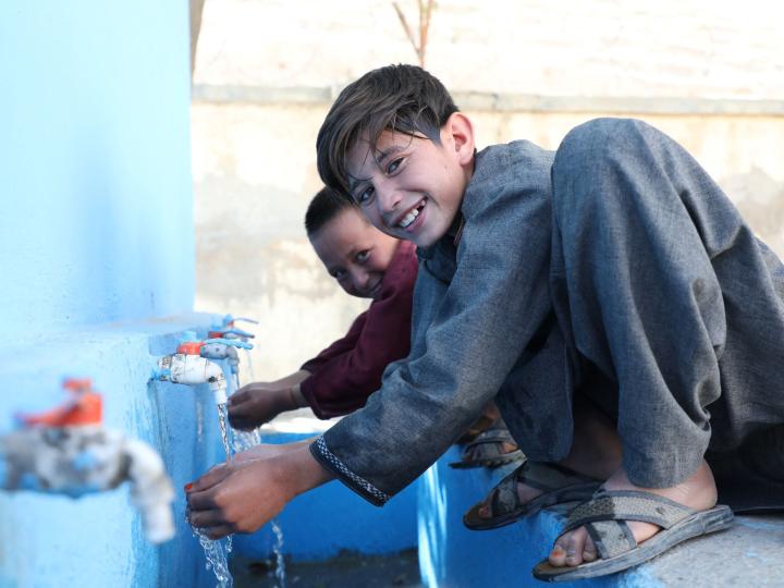 Children use clean water from water storage built by World Vision in their school 