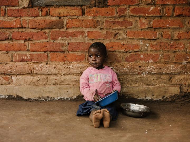 A girl eating from a bowl