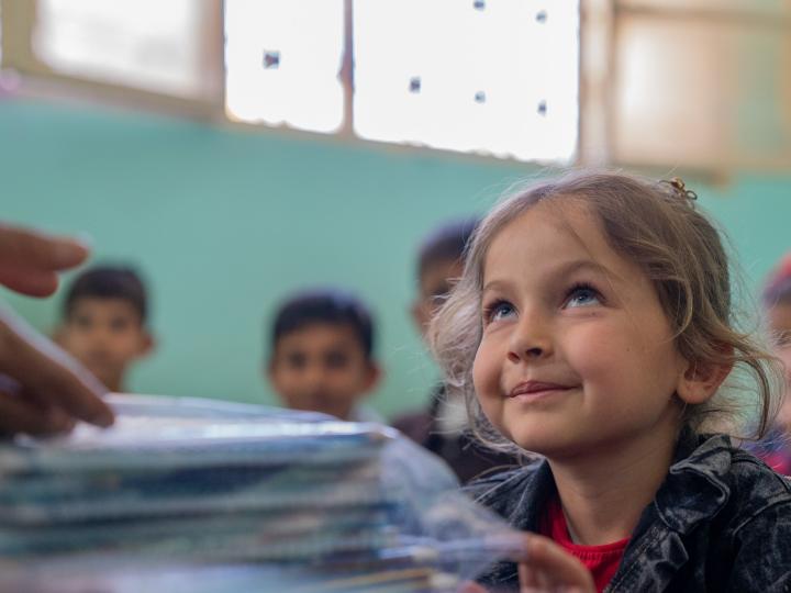 World Refugee Day- Girl learning in one of WVSR's schools