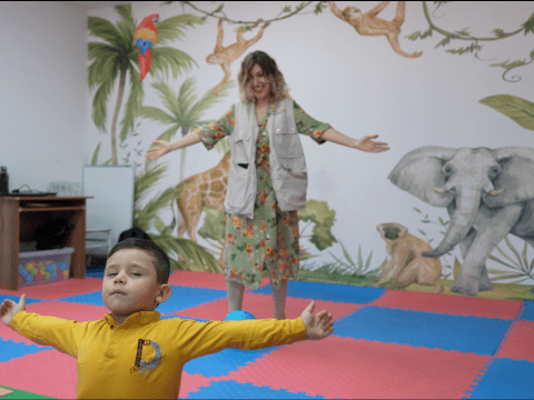 Maher doing the a famous move with his teacher Idil, World Vision Syria Response– Samer Asaid